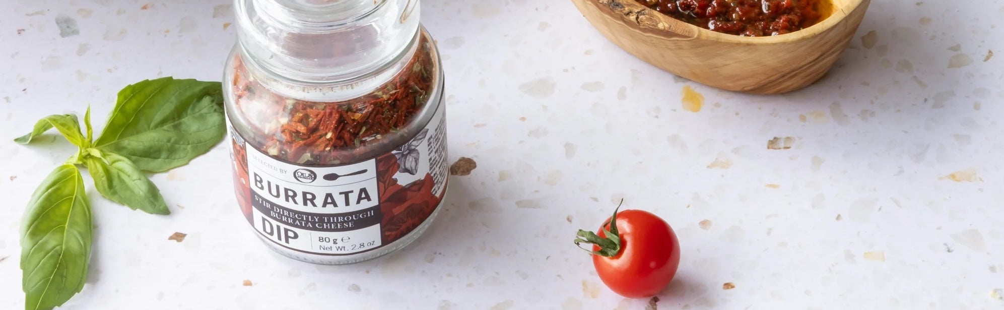 Burrata dipping spice blend displayed on a kitchen counter — a new gourmet arrival at Oil & Vinegar USA.