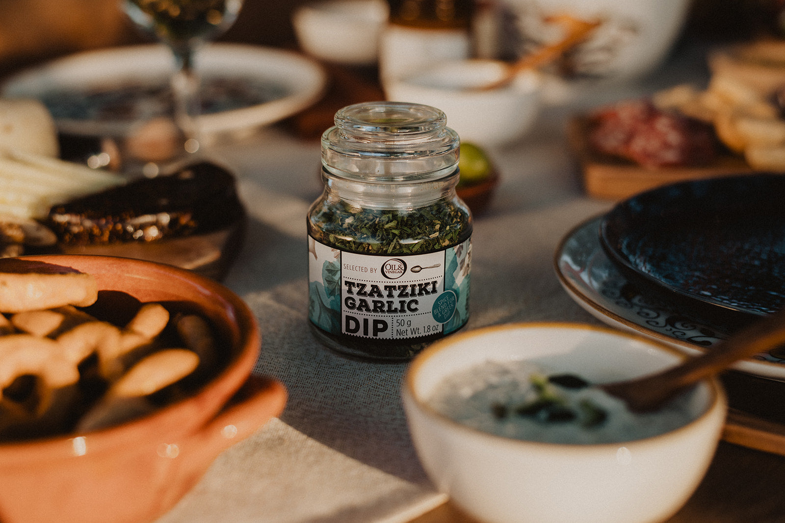 Colorful summer-themed kitchenware, snacks, and oils. Curated for warm weather cooking and entertaining.