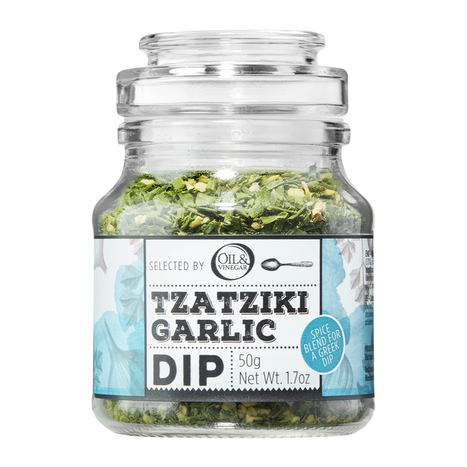 A jar of Tzatziki Garlic Dip showing the product label which includes herbs and indicates it is a garlic dip.